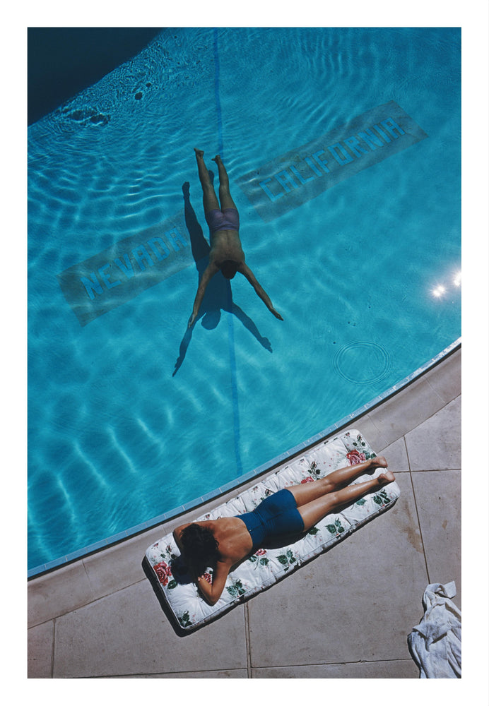 Swimmer And Sunbather photographic art print by Slim Aarons | Enter Gallery